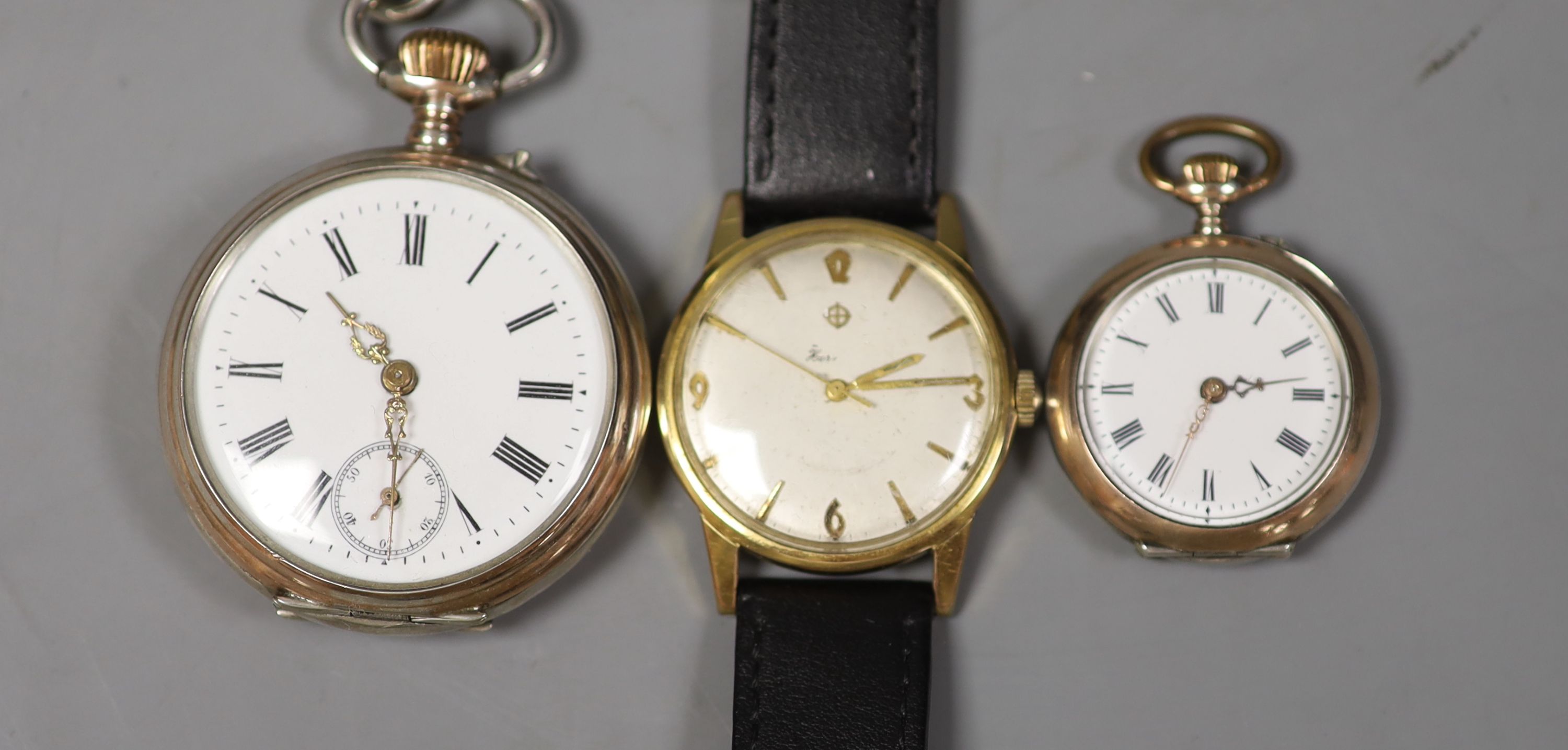 A Swiss silver pocket watch, a silver fob watch and a Zodiac wrist watch.